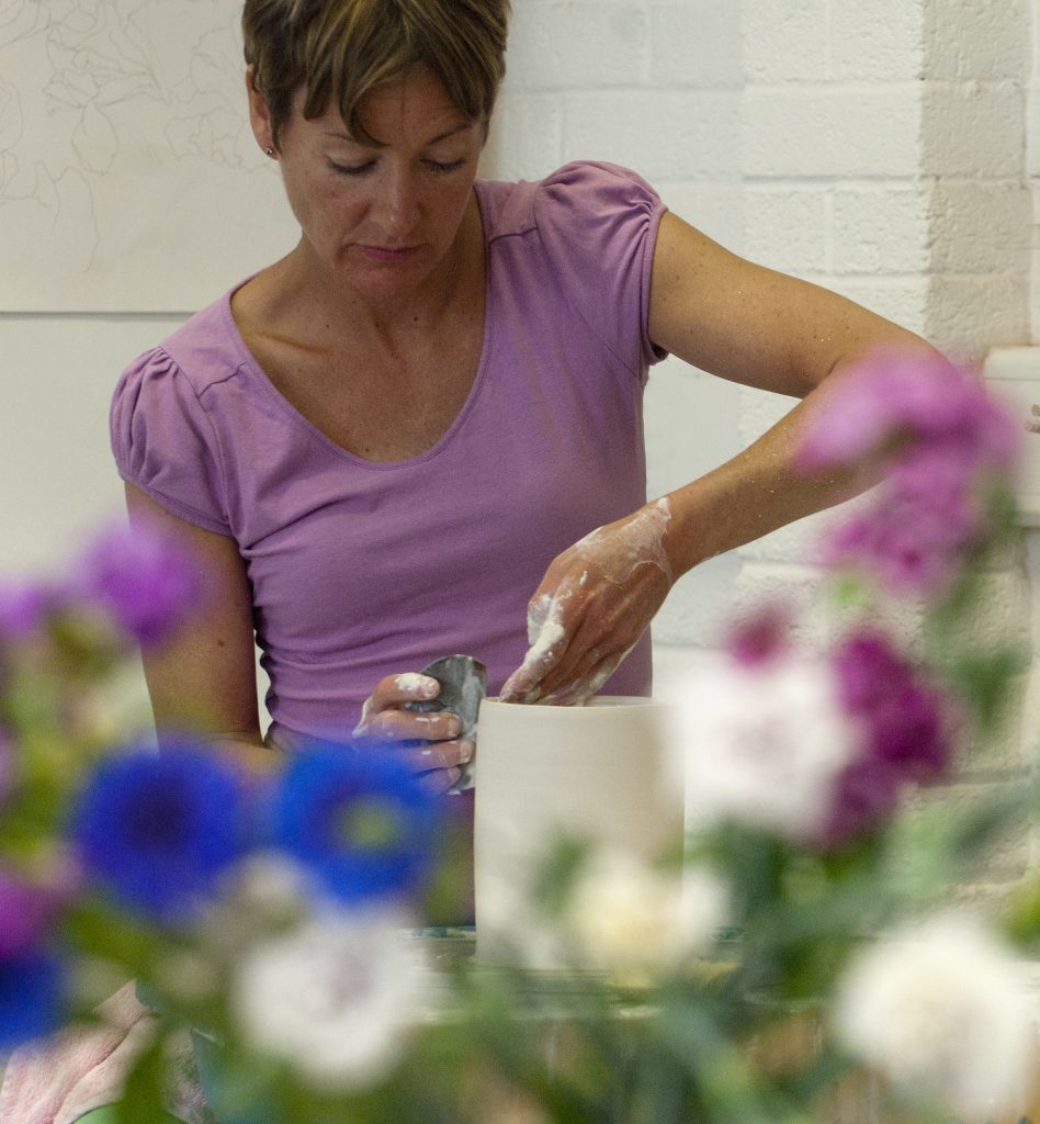 Rebecca Harvey throwing a clay pot on the wheel for a new collection